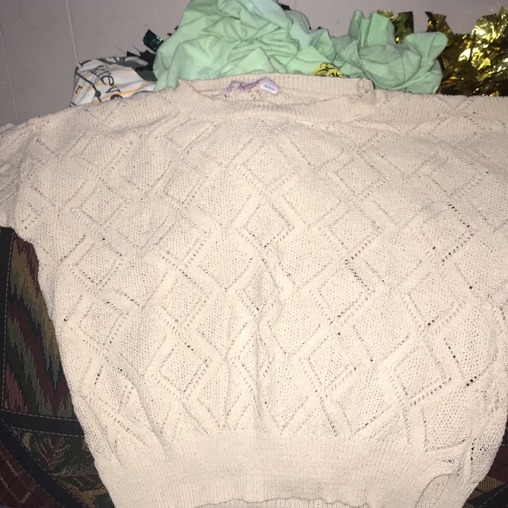 Tan sweater with diamonds on them